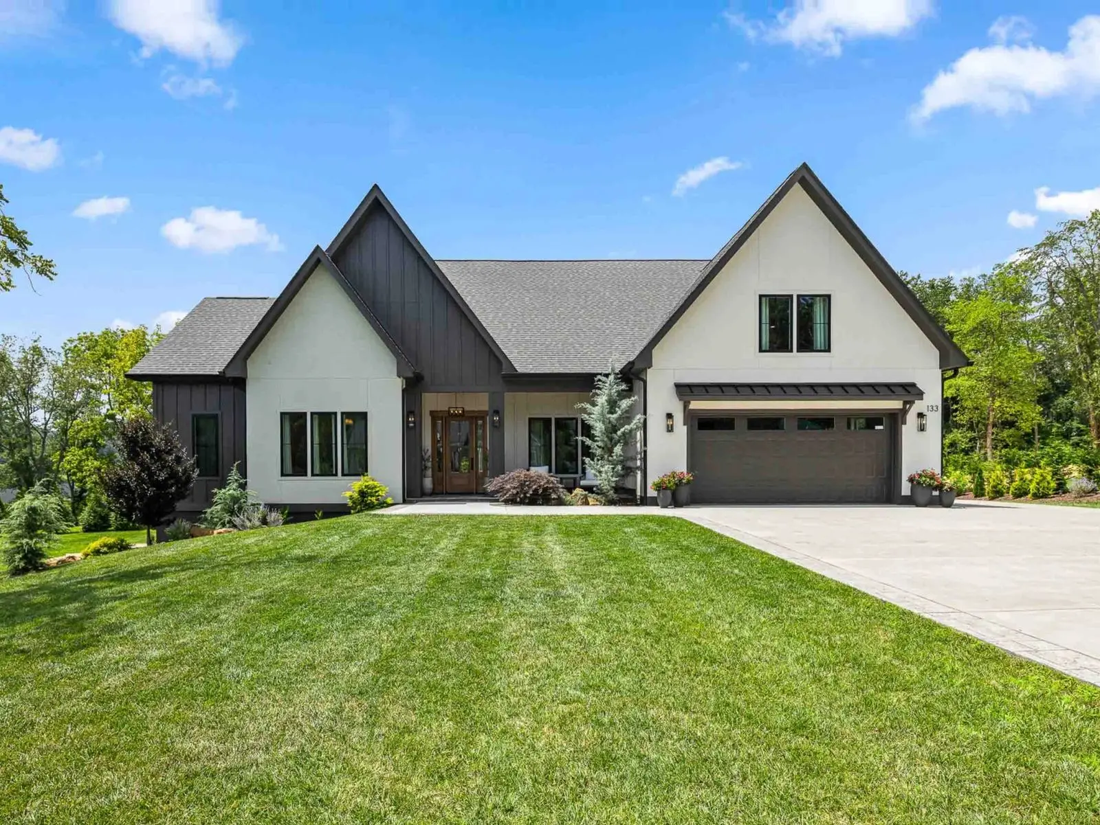 The same modern farmhouse photographed in daylight
