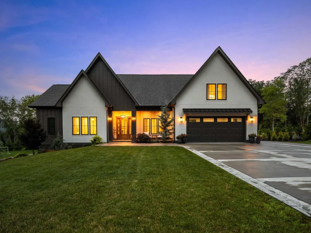 Modern farmhouse photographed at twilight in Fairview, North Carolina